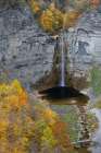 USA, New York. Creek, fall foliage and Taughannock Falls at State Park Art Print